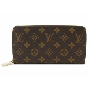 This Louis Vuitton Monogram Zippy Wallet has on the zipper handle